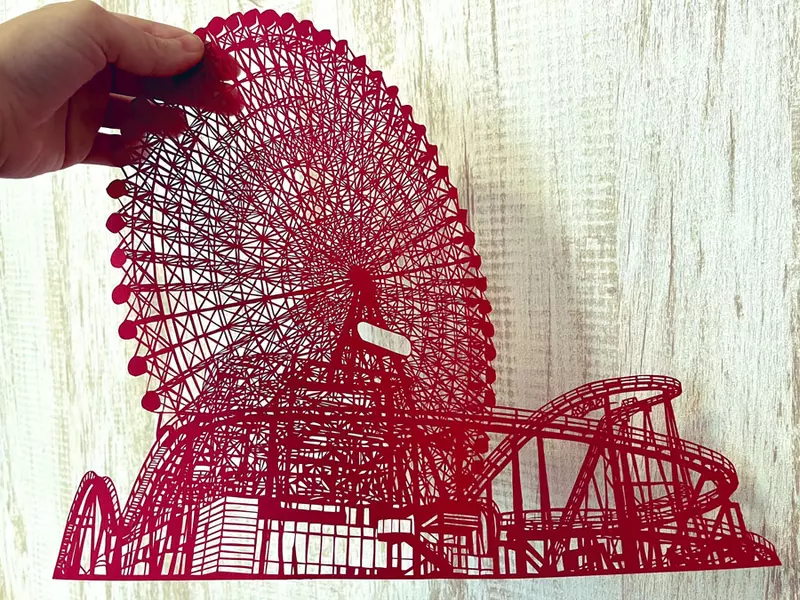 這塊紅紅一圈的可不是春聯 而是紙雕大師所創作的作品摩天輪